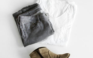 Gray jeans and a white t-shirt folded together