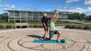 Kneeling Kettlebell Chop and Lift with Bicep Curl to Overhead Press